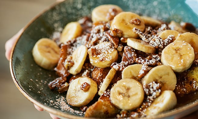 Bananas foster french toast drizzled with caramel