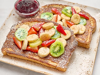 Thick-cut brioche covered with fresh banana, kiwi and seasonal berries then lightly dusted with powered cinnamon sugar.