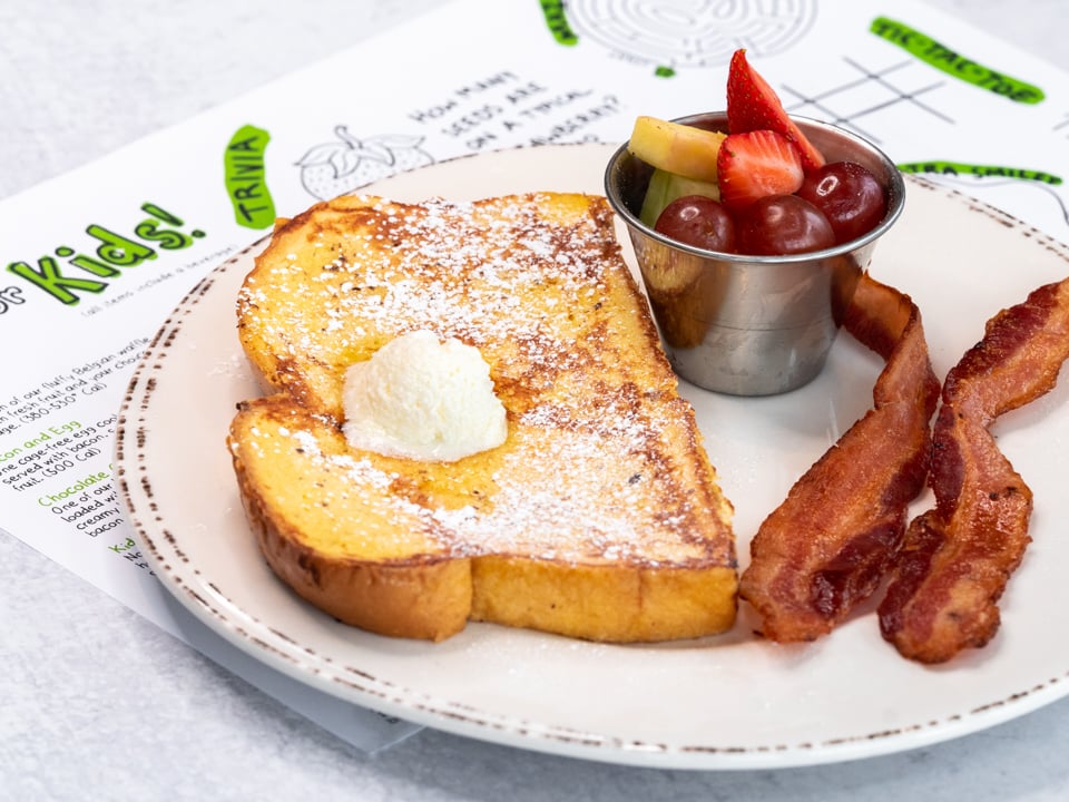 Made with our housemade batter. Served with fresh fruit and your choice of bacon or sausage.