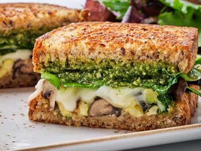 House-roasted Crimini mushrooms, zucchini and spinach with basil pesto, mayo and Mozzarella on our grilled artisan whole grain.