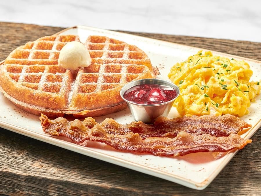 Two fresh cage-free eggs any style with either a light and airy Belgian waffle or a multigrain pancake. Plus your choice of bacon, chicken apple sausage patties, turkey or pork sausage links.