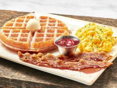 Two fresh cage-free eggs any style with either a light and airy Belgian waffle or a multigrain pancake. Plus your choice of bacon, chicken apple sausage patties, turkey or pork sausage links.