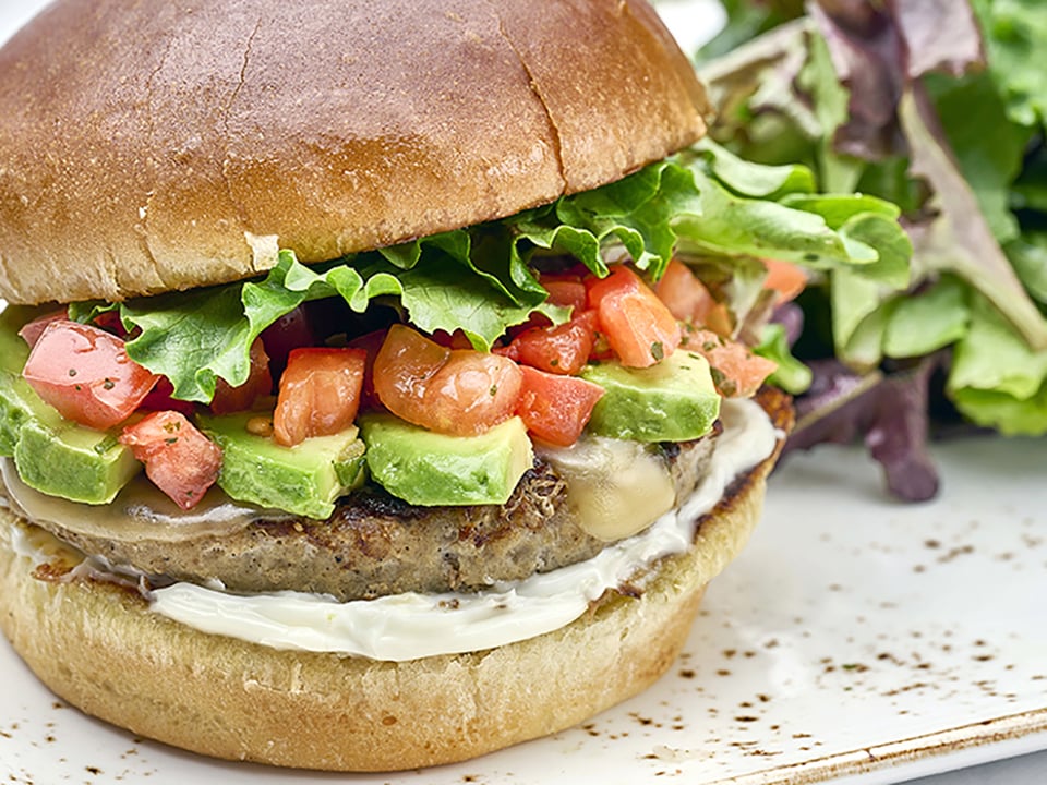 A seasoned all-natural patty of brown rice, Peppadew peppers, onions, carrots and mushrooms. Served on a brioche bun with fresh smashed avocado, organic mixed greens, tomato, red onion and a side of Dijonnaise.